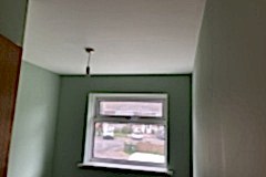 Bedroom completed.  Room re-plaster: Plaster directly over artex ceiling. Plaster all walls, window reveals. Painting and decorating undertaken and completed.