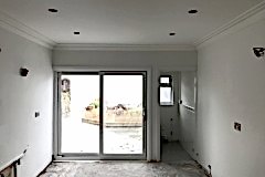 Kitchen re-plastered ceiling and walls, coving fitted.